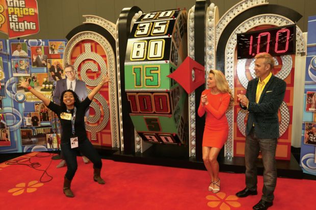 "The Price is Right" game show with money wheel and contestant to illustrate bottom line: should hiring figures steer course funding?