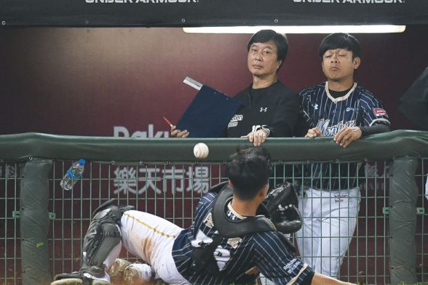 Chien Fu Liao #58 of Rakuten Monkeys miss a fly ball at the top of the 8th inning during the CPBL game to illustrate Taiwanese universities ‘may fall short’ of 2030 bilingual goal
