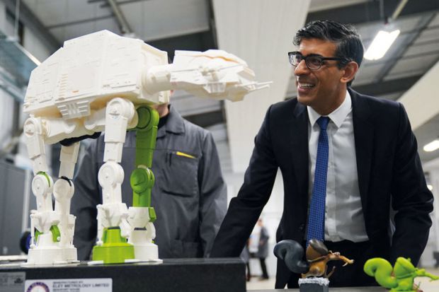 Prime Minister Rishi Sunak looks at a 3-D printed model of an All Terrain Armoured Transport Walker to illustrate Horizon association deal ‘opens door for Pioneer reappraisal’