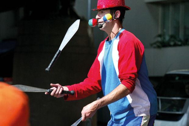 Busker juggles with three knives Busker juggles with three knives in Sydney, Australia to illustrate Nine in ten Australasian students juggling study with paid work