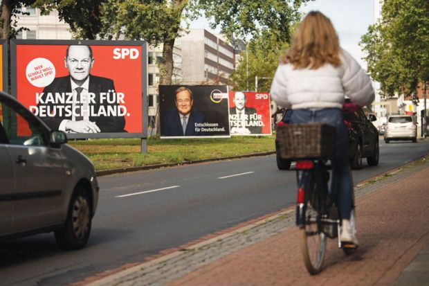Election campaign billboards showing Olaf Scholz, chancellor candidate of the German Social Democrats (SPD), and Armin Laschet, chancellor candidate of the Christian Democrats (CDU/CSU) Election campaign billboards showing Olaf Scholz, chancellor candidate of the German Social Democrats (SPD), and Armin Laschet, chancellor candidate of the Christian Democrats (CDU/CSU) illustrating the current election campaign