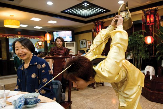 A martial arts master serves tea in a traditional teahouse to illustrate UK’s China expertise ‘needs more student demand’ to thrive