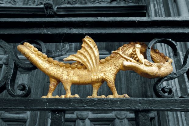 Dragon motif on the ironwork outside King's College Chapel, Cambridge to illustrate Bullying is a feature of UK research universities, not a bug