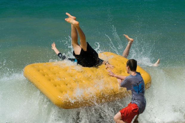 Boys fall off inflatable raft into sea