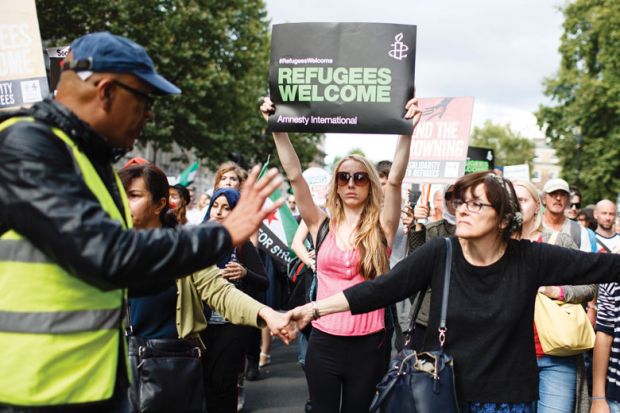  Demonstrators calling for greater government assistance for refugees 