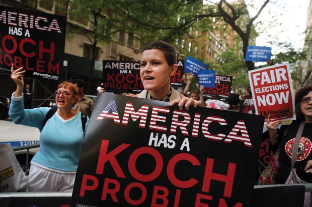 Activists hold a protest near the Manhattan apartment of billionaire and Republican financier David Koch as mentioned that the University of Austin has links to the Knoch brothers