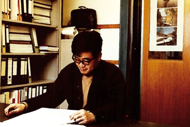 Weimin Wu at work in office, Switzerland