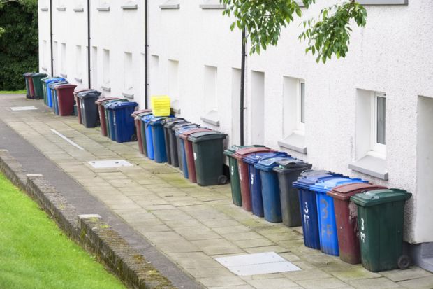 A row of wheelie bins A row of wheelie bins, symbolising quality over quantity