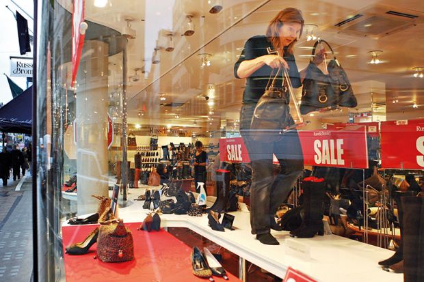 Sale display in shoe shop window