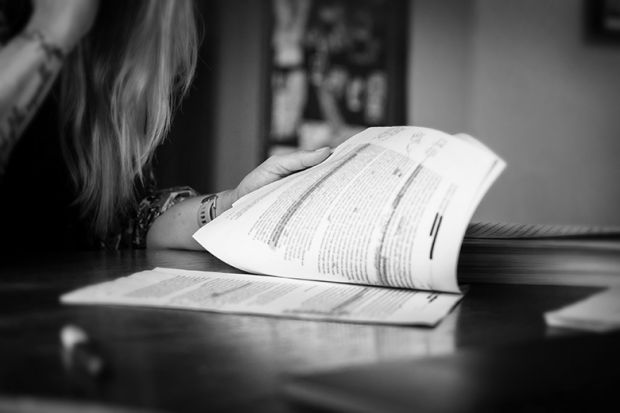 A woman thoroughly checking written work. To illustrate that to defend against prejudice, Agnieszka Piotrowska had to make her students’ work unassailable. A woman thoroughly checking written work. To illustrate that to defend against prejudice, Agnieszka Piotrowska had to make her students’ work unassailable.