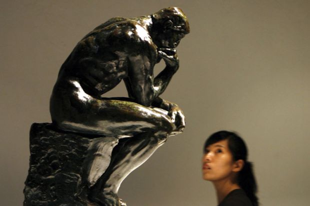 Woman looking at The Thinker sculpture, Auguste Rodin, Beijing World Art Museum