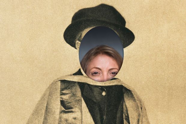 Woman peeking through face of photo of university graduate Woman peeking through face of photo of university graduate