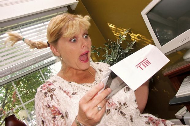 Woman shocked by reading utility bill Woman shocked by reading utility bill