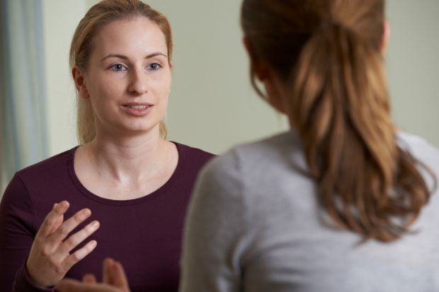 Woman speaks to counsellor
