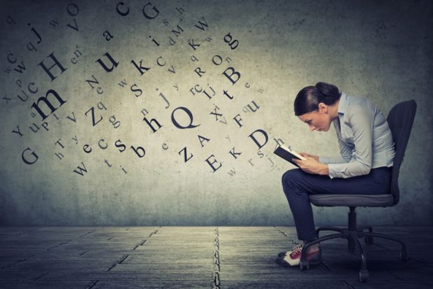 Woman reading with letters emerging from the book