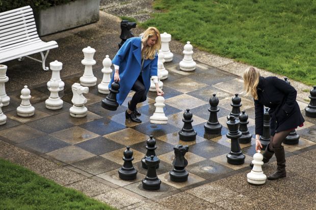 Women play chess on giant outdoor chessboard, Lausanne, Switzerland