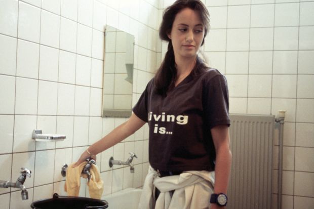 Young cleaning lady unhappy with work