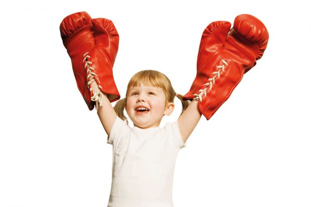 Young girl celebrating boxing victory