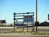 Sign supporting the Democratic Party on a shabby rack beside the road