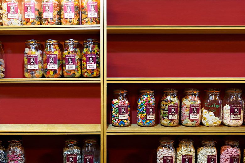 A variety of sweets in jars, with some of the shelves empty. To illustrate that LLE offers students the option to choose various modules, but there could be a limited number of providers.