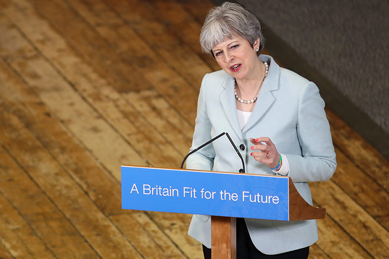 Former UK Theresa May delivers a speech at Derby College in 2018. She said England has “one of the most expensive systems of university tuition in the world” and called for better value.