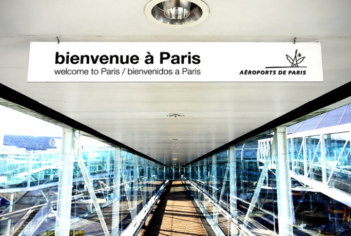A "welcome to Paris" sign at an airport A "welcome to Paris" sign at an airport