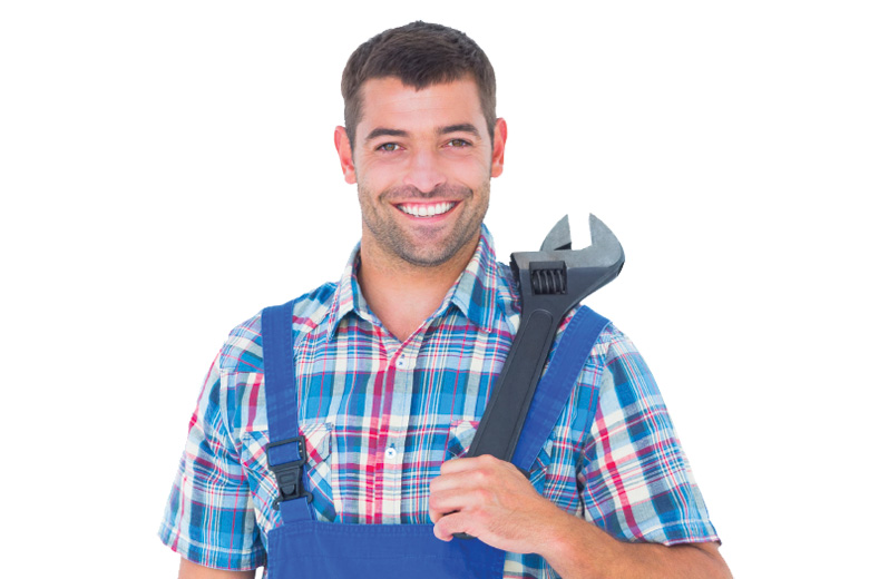 Workman smiling and holding adjustable wrench