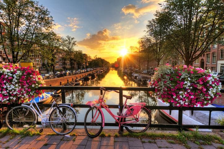 Amsterdam sunrise with bikes on the bank