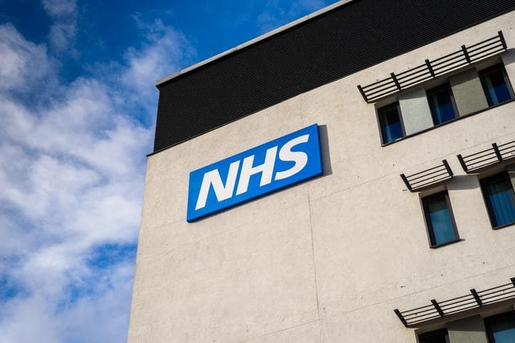 NHS sign on a building