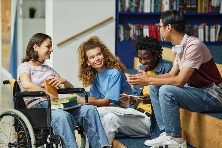 group of young multi-racial students sitting together