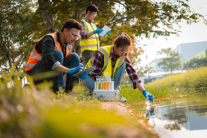 Scientists team collect water samples for analysis and research on water quality