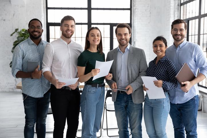 Portrait of happy diverse group of interns or students/ istock