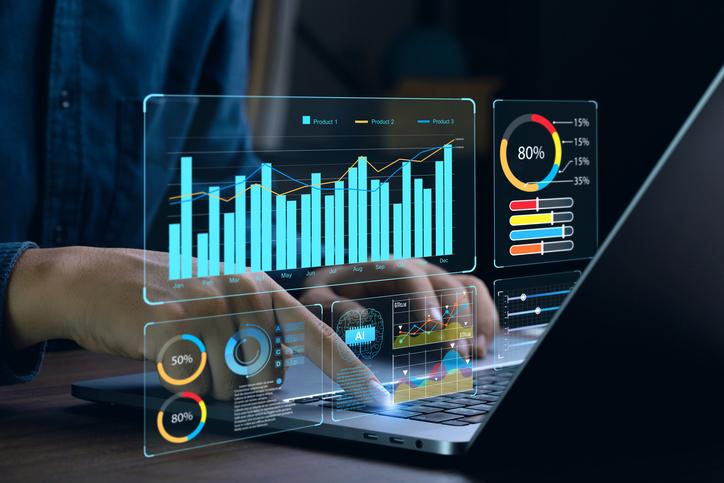 laptop showing business analytics dashboard with charts, metrics and data analysis/ iStock
