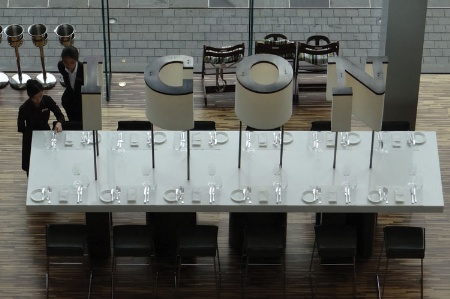 Waitresses setting places at Hotel ICON dining table