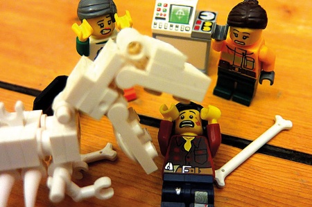 Lego figure being eaten by dinosaur