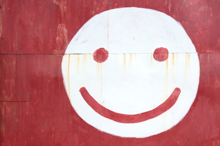 National Student Survey 2014 results, smiley face painted on red wall