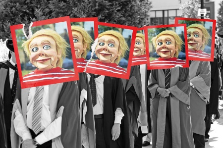 Queue of university graduates with puppet heads photos pasted over faces