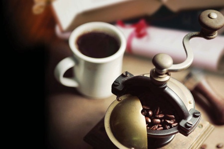 Coffee grinder beside a legal document