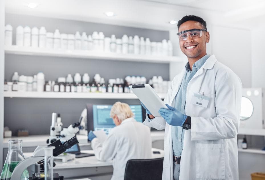Man with a clipboard in a research lab